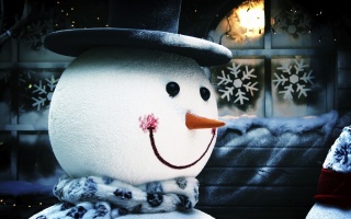 сніговик в шарфі, в шапці, ніс-морквина